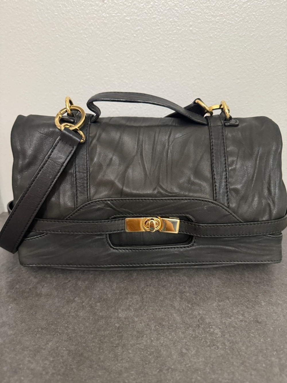 BCBGMaxAzria Black Leather Handbag with Embossed Logo